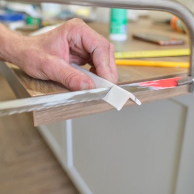 Repair in the house, installation and cutting of wooden painted corners.
